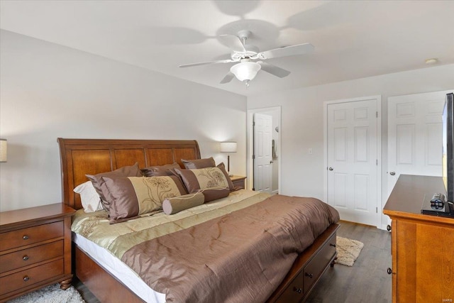 bedroom with dark wood-type flooring and a ceiling fan