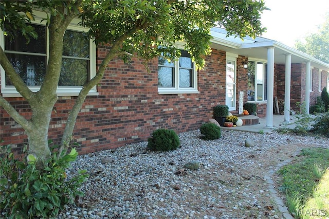 462 Il Route 127, Greenville, IL 62246 - view of property exterior featuring brick siding and a porch
