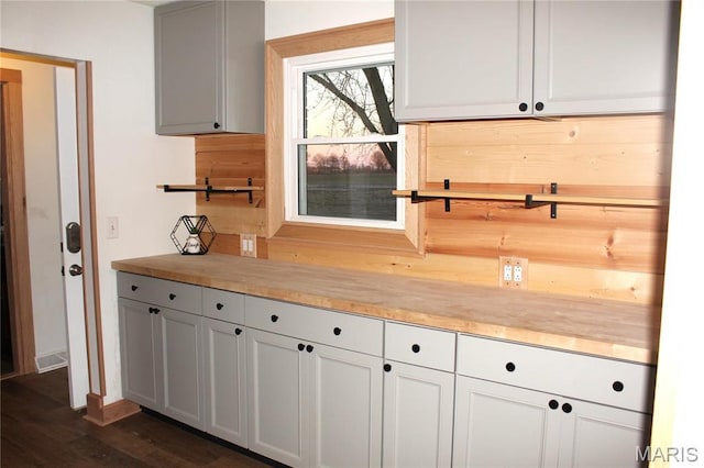 462 Il Route 127, Greenville, IL 62246 - kitchen with wooden counters, dark wood finished floors, and baseboards