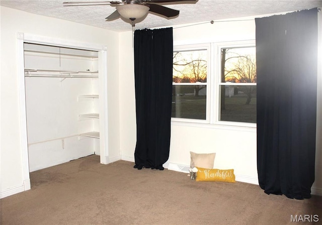 462 Il Route 127, Greenville, IL 62246 - unfurnished bedroom with carpet flooring, a textured ceiling, a closet, ceiling fan, and baseboards