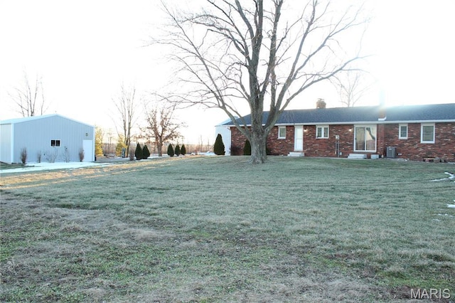 462 Il Route 127, Greenville, IL 62246 - view of green lawn with an outdoor structure, central air condition unit, entry steps, and an outbuilding