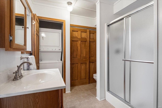 2630 Grendel Dr, Innsbrook, MO 63390 - bathroom with stacked washer / drying machine, a stall shower, toilet, and vanity
