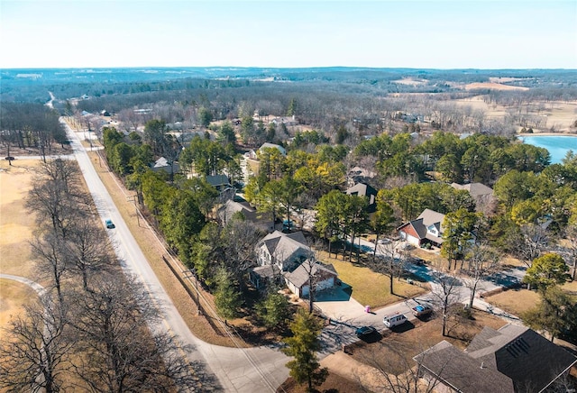 aerial view of property and surrounding area featuring nearby suburban area