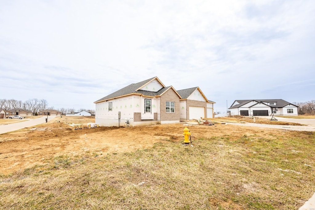 212 Ashurst Ln, Ofallon, IL 62269 - property in mid-construction featuring an attached garage