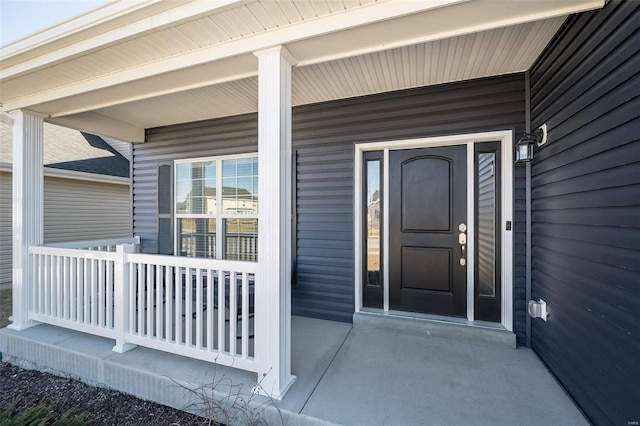 doorway to property featuring covered porch