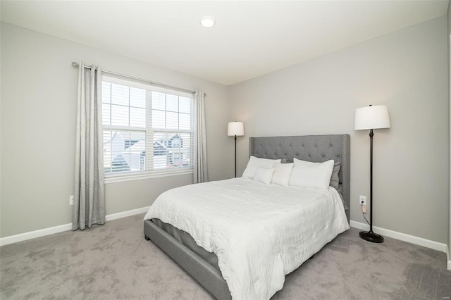 bedroom featuring carpet flooring and baseboards