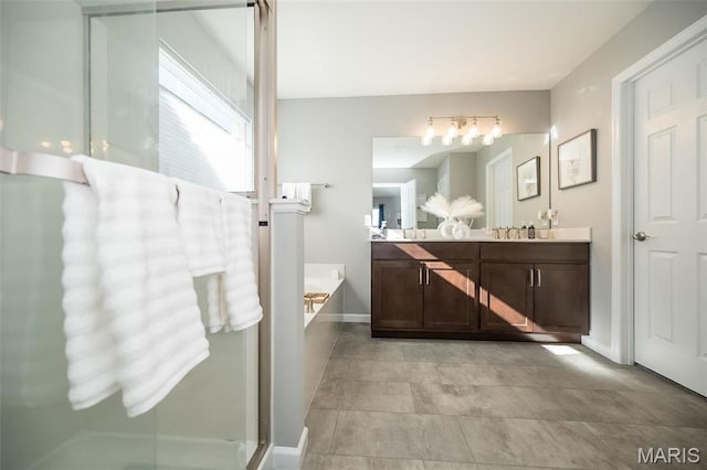 408 Sawgrass Ct, Saint Charles, MO 63301 - full bath featuring a bath, double vanity, baseboards, and a shower with shower door
