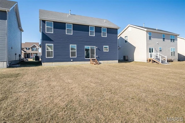 408 Sawgrass Ct, Saint Charles, MO 63301 - back of house with entry steps, a lawn, and cooling unit