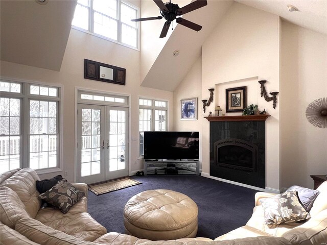 19383 Dabbs N Rd, Jerseyville, IL 62052 - carpeted living area featuring a fireplace, high vaulted ceiling, a ceiling fan, french doors, and baseboards
