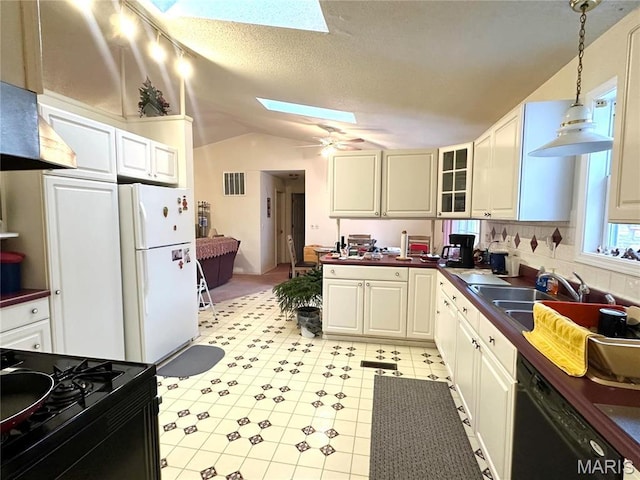6474 State Highway H, Benton, MO 63736 - kitchen with black appliances, a skylight, lofted ceiling, dark countertops, and a ceiling fan