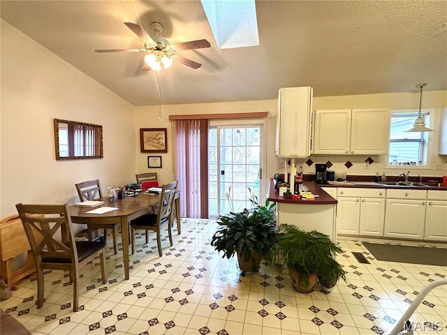 6474 State Highway H, Benton, MO 63736 - kitchen featuring a sink, ceiling fan, vaulted ceiling, white cabinets, and light tile patterned floors