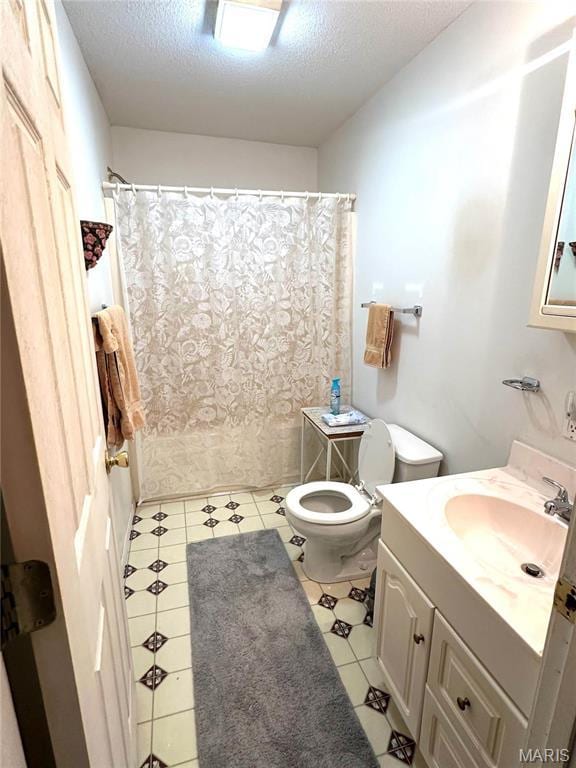 6474 State Highway H, Benton, MO 63736 - bathroom featuring toilet, vanity, a textured ceiling, tile patterned flooring, and shower / tub combo