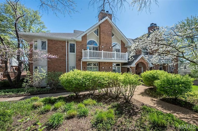 12 Country Club Ter, Glendale, MO 63122 - rear view of house featuring a balcony, a chimney, and brick siding