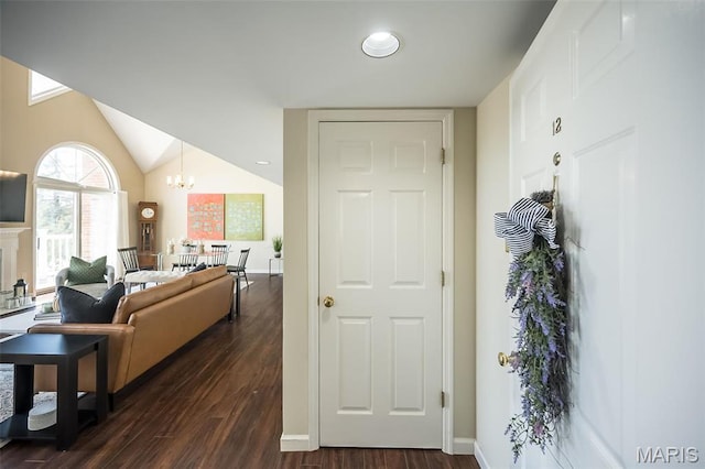 12 Country Club Ter, Glendale, MO 63122 - living area with dark wood-style flooring, a chandelier, vaulted ceiling, and baseboards