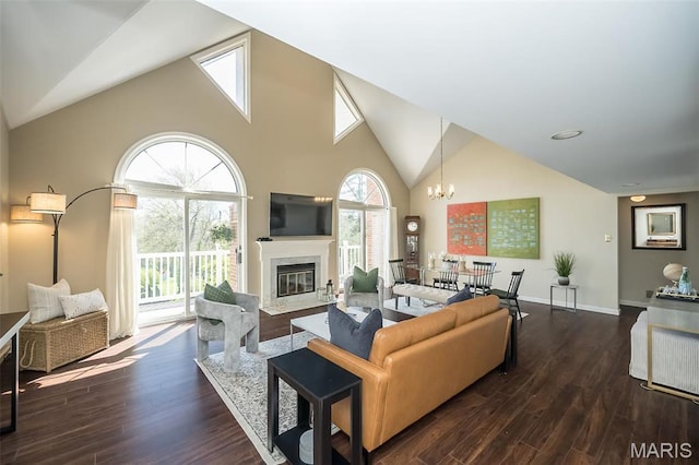 12 Country Club Ter, Glendale, MO 63122 - living room featuring dark wood-style floors, a fireplace with flush hearth, high vaulted ceiling, a chandelier, and baseboards