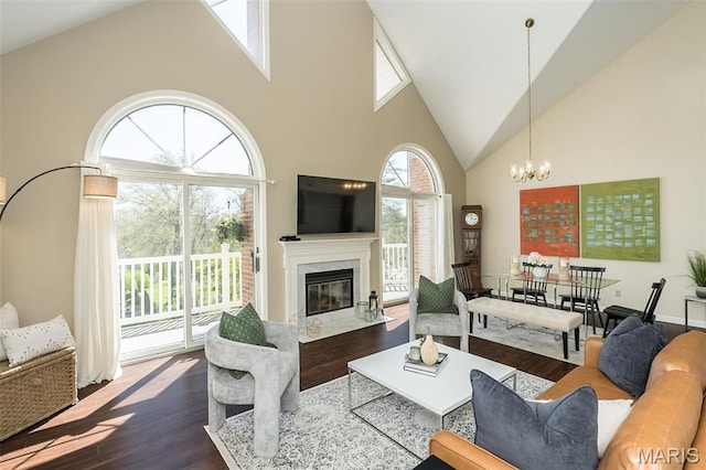 12 Country Club Ter, Glendale, MO 63122 - living room featuring high vaulted ceiling, dark wood finished floors, a chandelier, and a high end fireplace