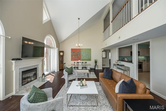12 Country Club Ter, Glendale, MO 63122 - living area featuring high vaulted ceiling, a chandelier, wood finished floors, a premium fireplace, and baseboards
