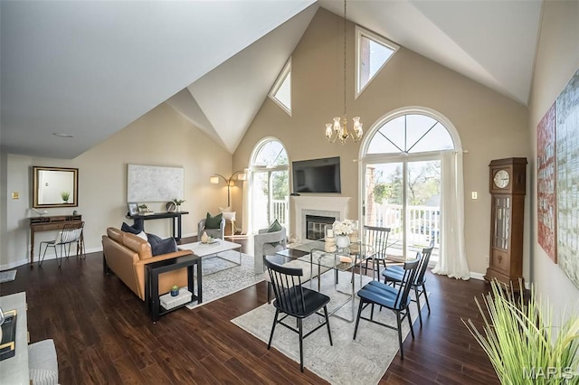 12 Country Club Ter, Glendale, MO 63122 - dining room featuring a glass covered fireplace, high vaulted ceiling, wood finished floors, a chandelier, and baseboards