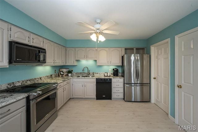 12 Country Club Ter, Glendale, MO 63122 - kitchen featuring black appliances, a sink, light wood-type flooring, and ceiling fan