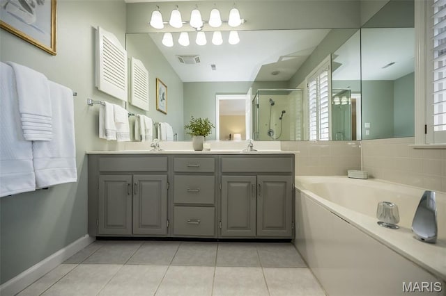 12 Country Club Ter, Glendale, MO 63122 - full bathroom with a stall shower, double vanity, tile patterned flooring, a garden tub, and baseboards
