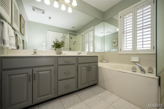 12 Country Club Ter, Glendale, MO 63122 - full bath with a stall shower, double vanity, tile patterned flooring, and a bath