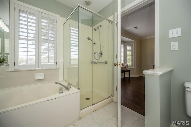 12 Country Club Ter, Glendale, MO 63122 - bathroom featuring tile patterned floors, a bath, a shower stall, toilet, and crown molding