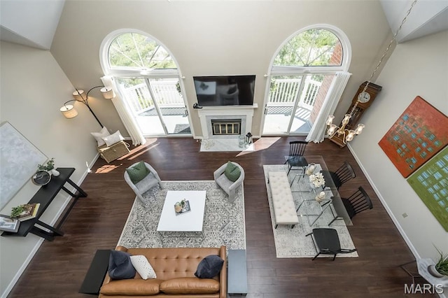 12 Country Club Ter, Glendale, MO 63122 - living area with healthy amount of natural light, a high end fireplace, a towering ceiling, and baseboards