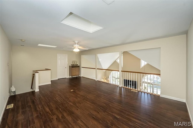 12 Country Club Ter, Glendale, MO 63122 - spare room with ceiling fan, a skylight, wood finished floors, and baseboards