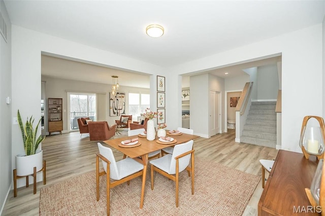 5019 Pacific Crest Trl, Cottleville, MO 63304 - dining space with stairway, light wood-style flooring, and baseboards