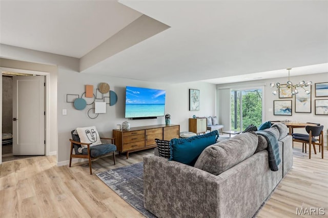 5019 Pacific Crest Trl, Cottleville, MO 63304 - living area featuring a chandelier, light wood-style floors, and baseboards
