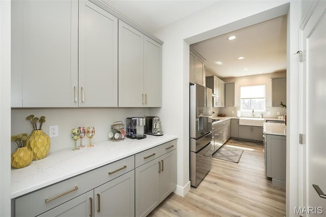 5019 Pacific Crest Trl, Cottleville, MO 63304 - kitchen with stainless steel fridge with ice dispenser, gray cabinets, and recessed lighting