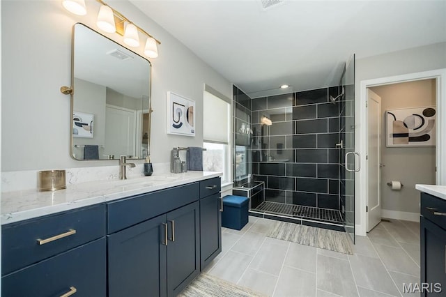 5019 Pacific Crest Trl, Cottleville, MO 63304 - bathroom featuring a shower stall, vanity, and tile patterned flooring