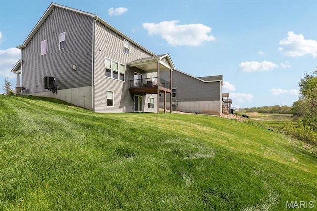 5019 Pacific Crest Trl, Cottleville, MO 63304 - rear view of property with a lawn, a balcony, and central AC