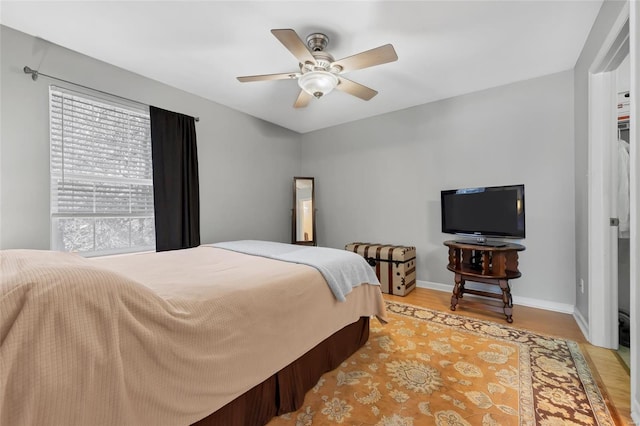 14 Eagle Rock Cv Unit 307, Valley Park, MO 63088 - bedroom with light wood-style floors, baseboards, and ceiling fan