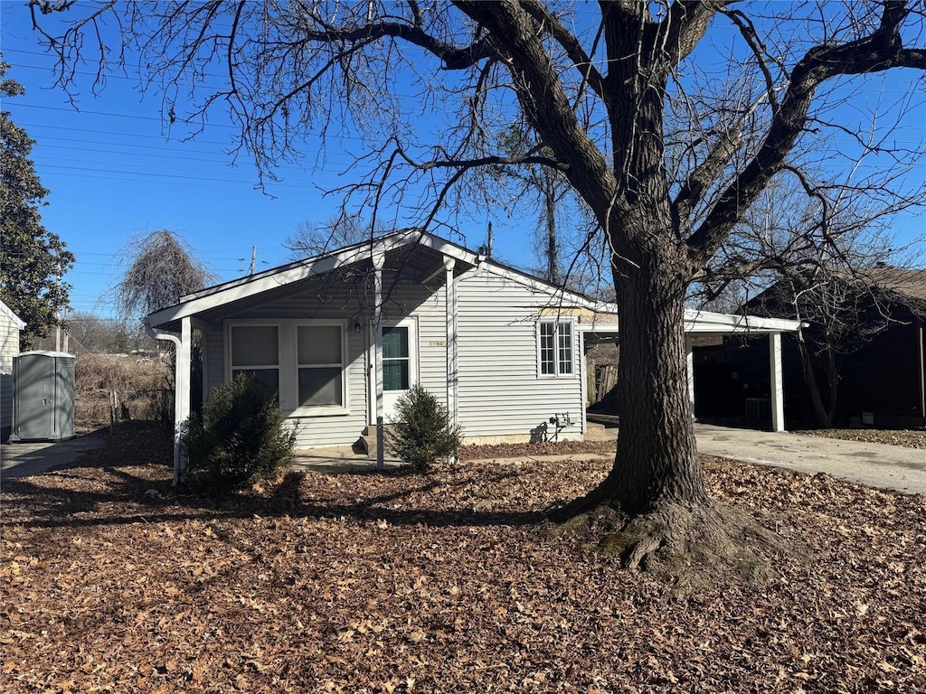 11942 Criterion Ave, Saint Louis, MO 63138 - view of home's exterior featuring driveway and a carport