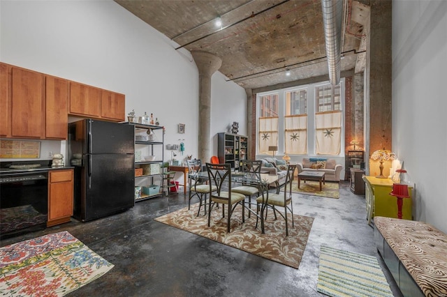 1511 Locust St Unit 101, Saint Louis, MO 63103 - dining space featuring concrete floors and a towering ceiling