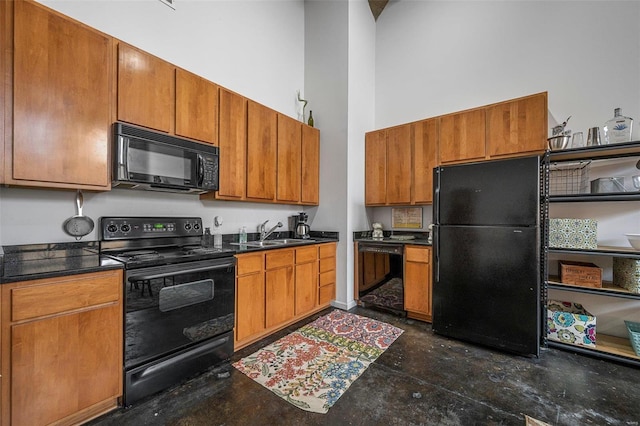 1511 Locust St Unit 101, Saint Louis, MO 63103 - kitchen featuring black appliances, concrete flooring, a sink, a towering ceiling, and dark countertops