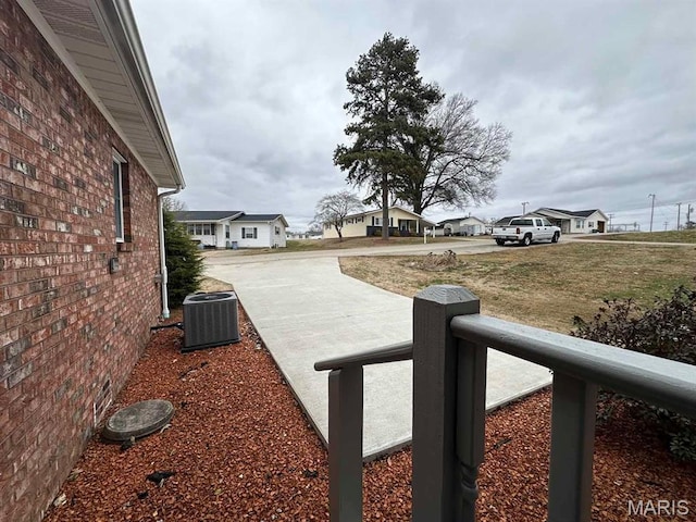 501 Forrest, Dexter, MO 63841 - view of yard with central air condition unit, driveway, and a residential view