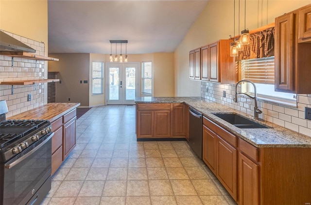 kitchen with black gas stove, a sink, stainless steel dishwasher, and backsplash