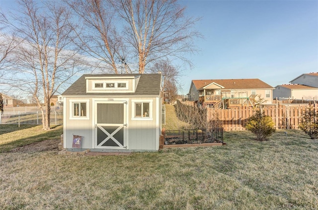 view of shed featuring a residential view and a garden