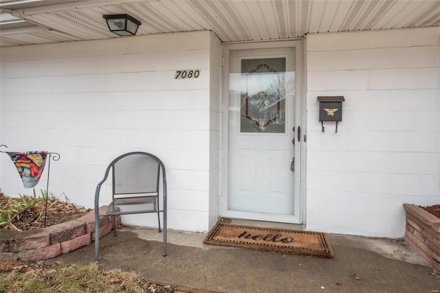 entrance to property with concrete block siding