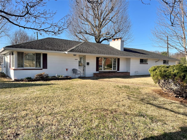single story home featuring a chimney, a front yard, and a shingled roof