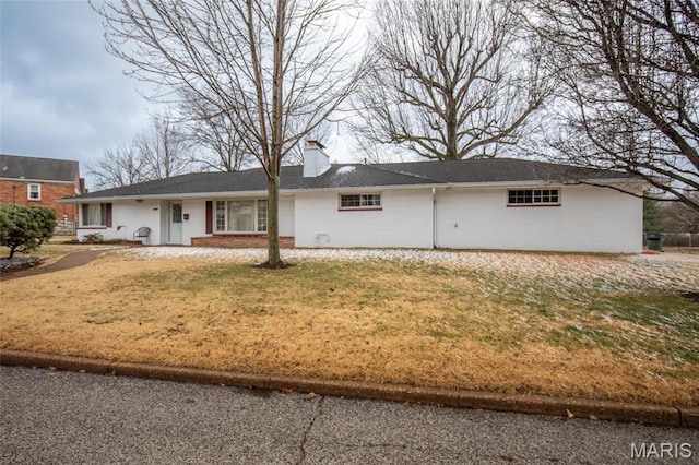 7080 Plainview Ave, Saint Louis, MO 63109 - view of front of home with a chimney, a front yard, and brick siding