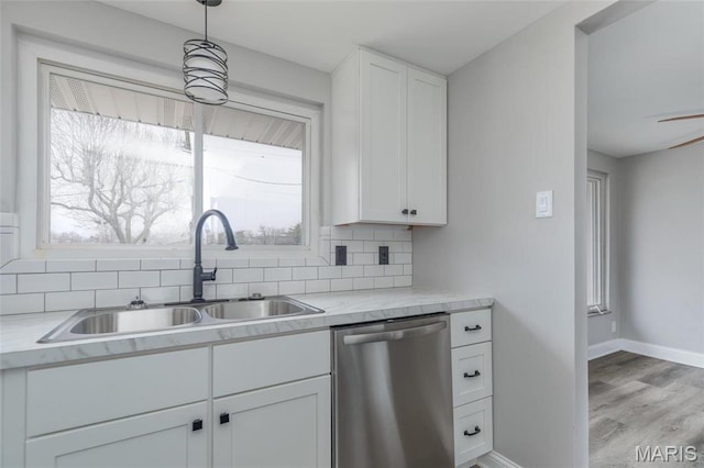 7080 Plainview Ave, Saint Louis, MO 63109 - kitchen with dishwasher, a sink, decorative backsplash, white cabinets, and light countertops