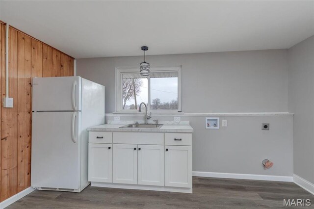 7080 Plainview Ave, Saint Louis, MO 63109 - kitchen with a sink, freestanding refrigerator, white cabinetry, dark wood-style floors, and light countertops