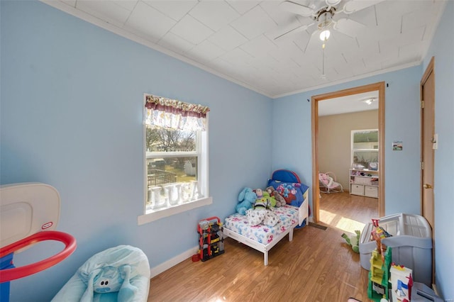 402 Virginia Ave, Potosi, MO 63664 - bedroom featuring crown molding, wood finished floors, ceiling fan, and baseboards