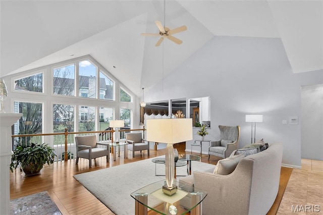 12537 Clark Manor Cir, Creve Coeur, MO 63141 - living area with high vaulted ceiling, a ceiling fan, healthy amount of natural light, and light wood-style flooring