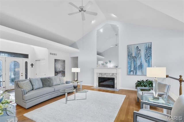 12537 Clark Manor Cir, Creve Coeur, MO 63141 - living room featuring a ceiling fan, high vaulted ceiling, a fireplace, wood finished floors, and baseboards