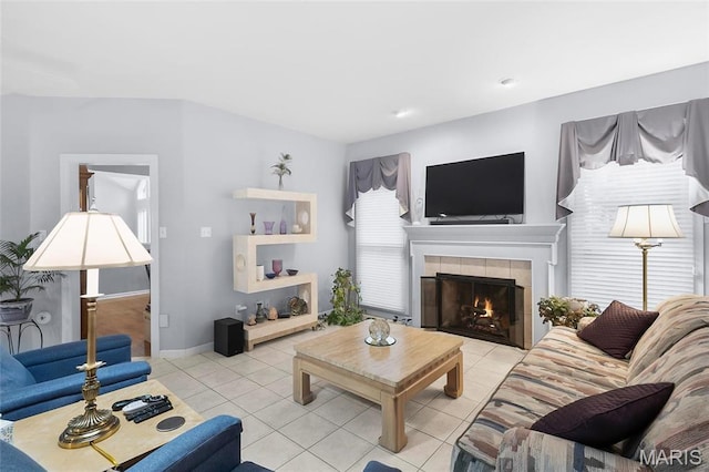 12537 Clark Manor Cir, Creve Coeur, MO 63141 - living area with light tile patterned flooring, a tiled fireplace, and baseboards