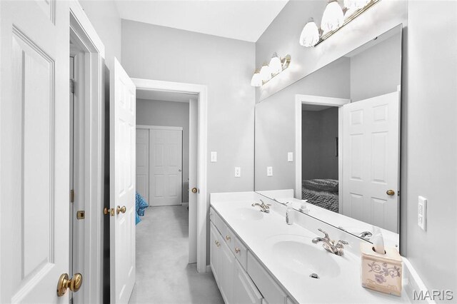 12537 Clark Manor Cir, Creve Coeur, MO 63141 - bathroom with ensuite bathroom, double vanity, and baseboards